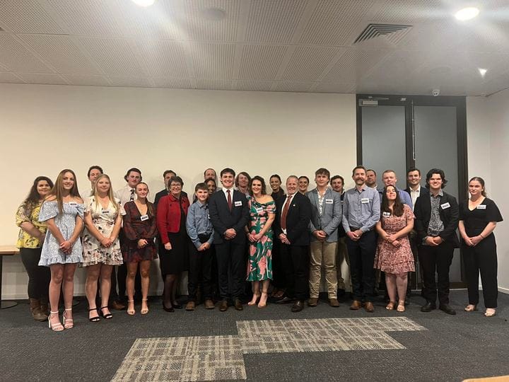 Large group of people at a formal event.